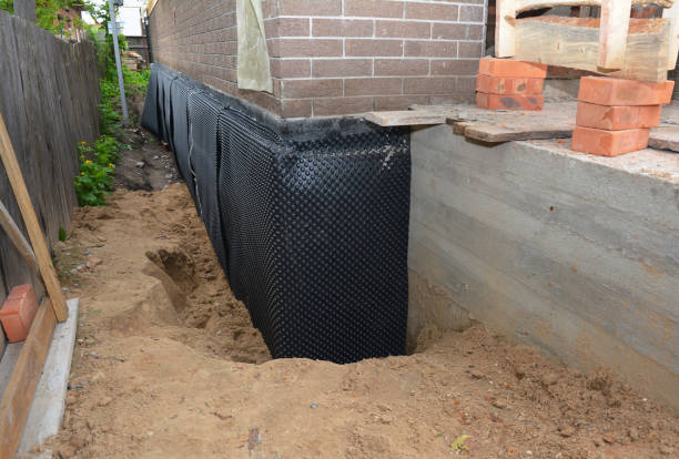 SJ Waterproofing Pros technician performing targeted Waterproofing assessment in Jackson, TN